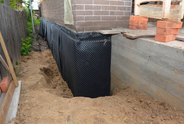 Happy homeowners after waterproofing job in Brigantine